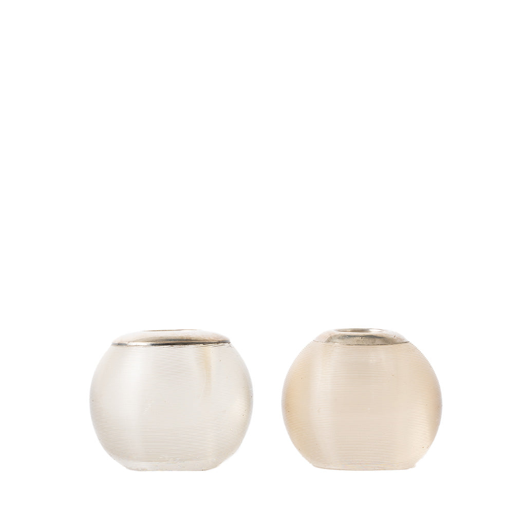Two small round glass match holders with a brushed silver finish, shown side by side on a plain white background.