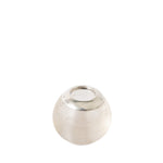A small silver-toned metal container or cap with a ribbed textured body and a smooth circular top, photographed on a plain white background.