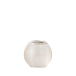 A small round textured glass match holder with a ribbed, matte off-white body and a contrasting metallic silver lid, set against a solid white background.