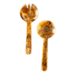 Two-piece serving set in brown resin with natural marbled variations. Includes a rounded serving spoon and coordinating fork, each with a glossy resin finish and organic patterning.