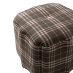 Plaid patterned ottoman on a white background