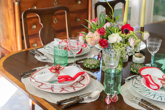 A Very Merry Christmas tablescape with red and green tabletop items