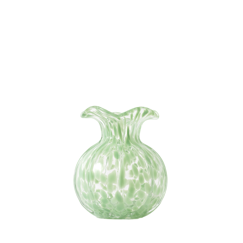 Green glass vase with textured surface on a white background