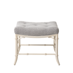 Stool with patterned cushion on a white background