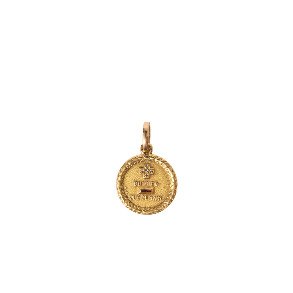 Gold pendant on a white background