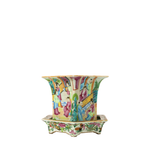Colorful Canton Famille Rose porcelain jardiniere with vibrant figures and floral motifs on a matching square stand.