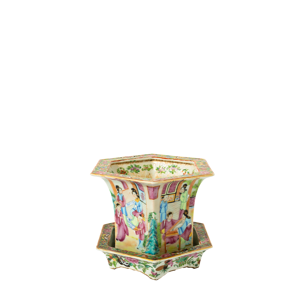 Hexagonal Famille Rose porcelain jardiniere with colorful hand-painted scenes and floral patterns, resting on a matching.