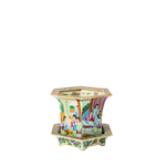 Hexagonal Canton Famille Rose porcelain jardiniere with colorful hand-painted figures and floral motifs, resting on a.