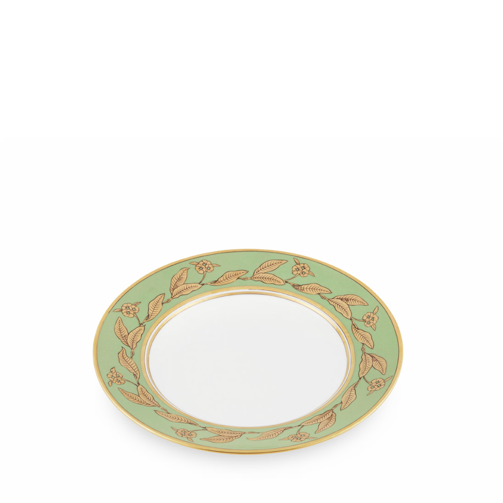 Decorative plate with green rim and gold floral patterns on a white background