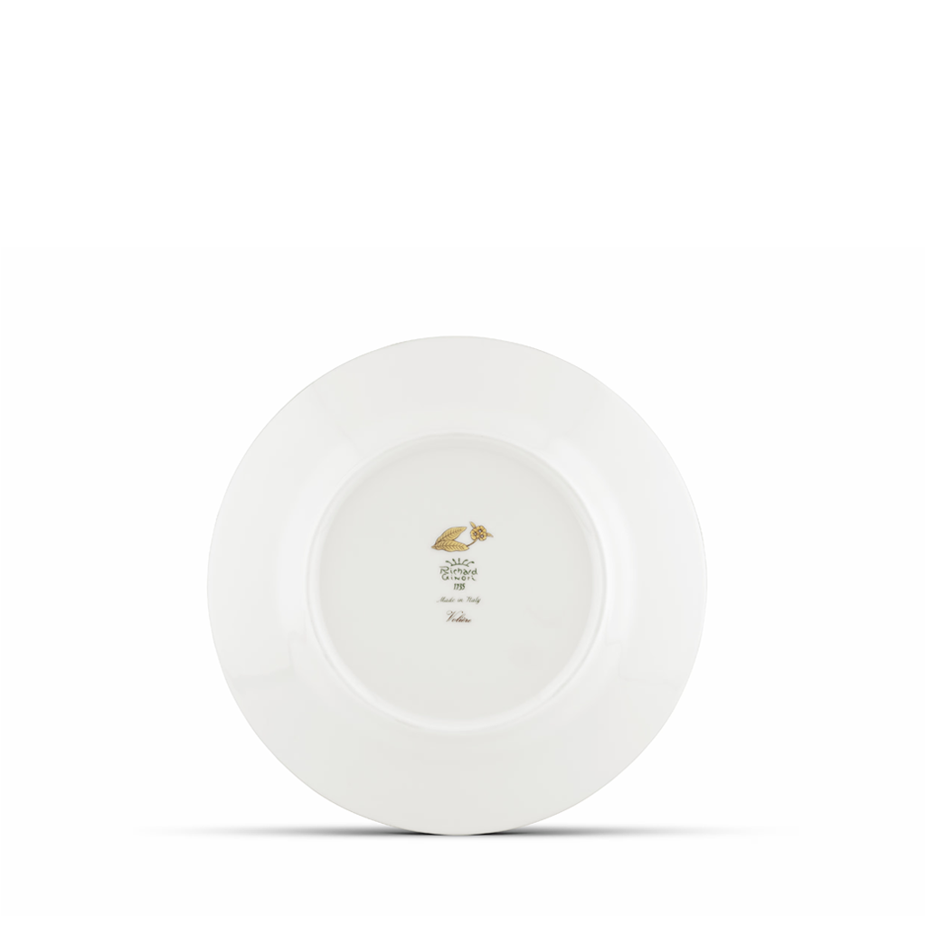 White ceramic plate with a gold logo on a white background