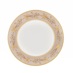 Decorative plate with gold floral patterns on a beige background