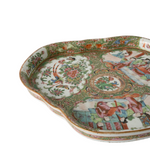 A decorative porcelain tray with hand-painted figures and floral motifs in a classic multicolor enamel style, shown on a plain white background.