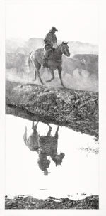 Man riding a horse reflected in water with mountains in the background
