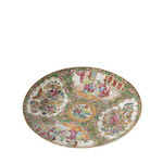 Decorative ceramic plate with intricate patterns on a white background