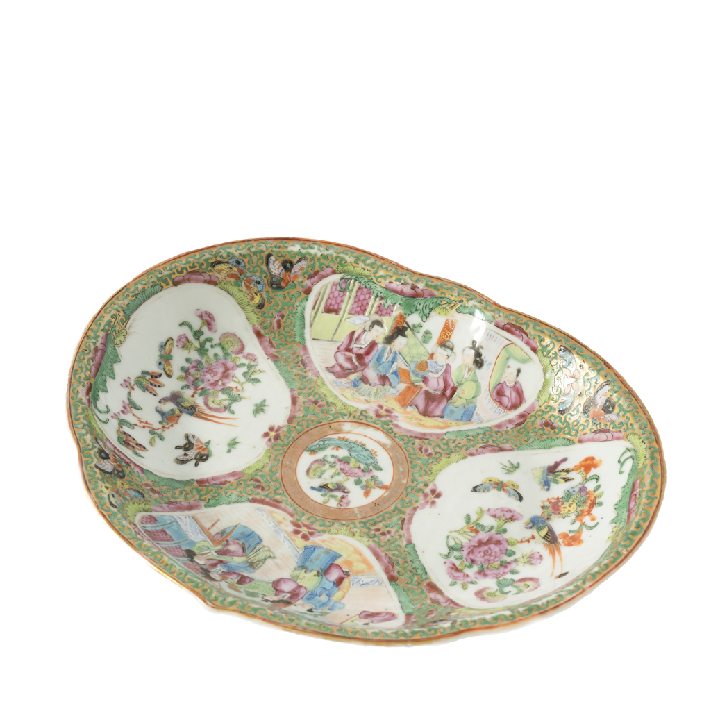 Decorative ceramic plate with colorful floral and figurine designs on a white background