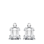 Two clear crystal salt and pepper shakers on a white background