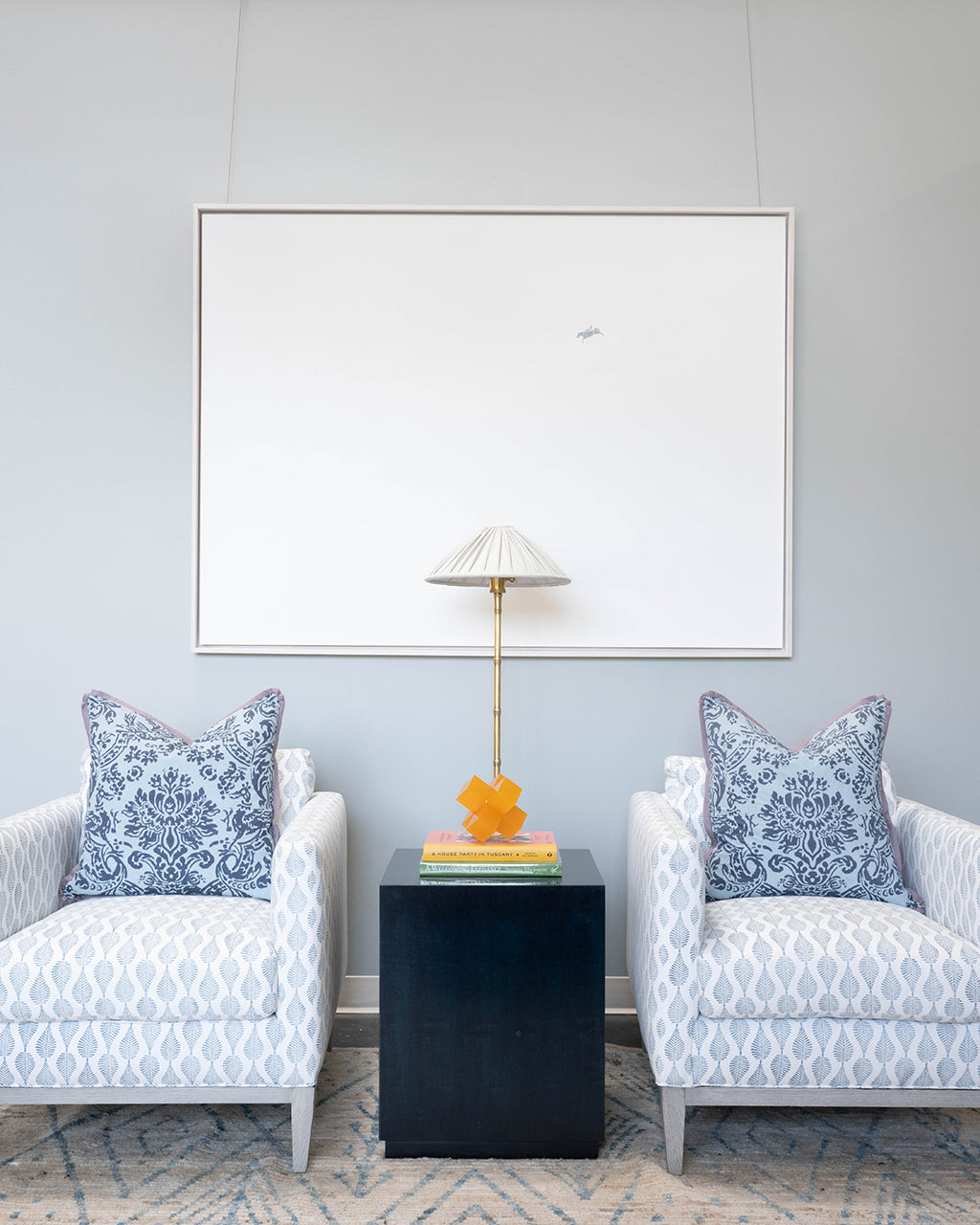 blue patterned pillows on chairs