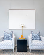 blue patterned pillows on chairs