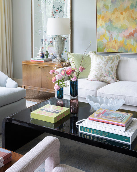 coffee table with books and onda glass centerpiece