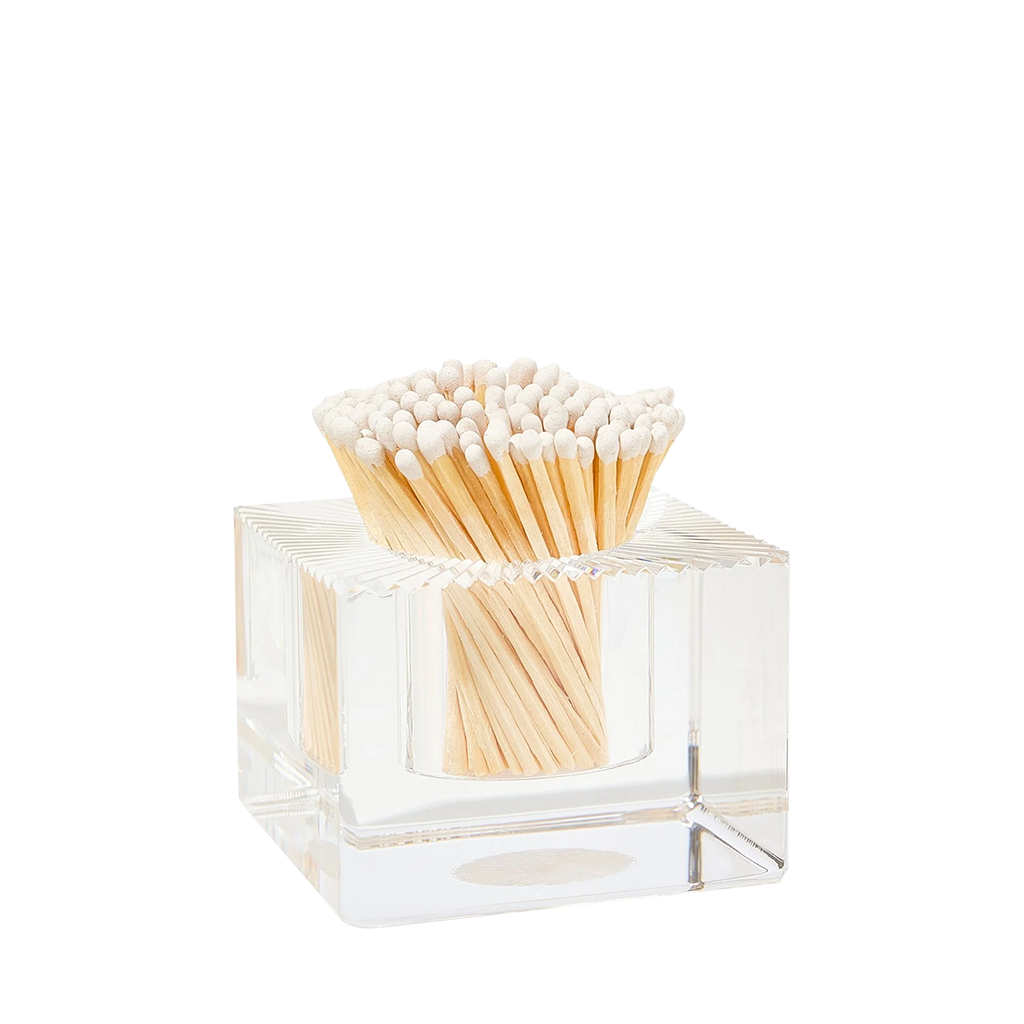 Clear glass container with matches on a white background