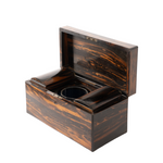 A dark brown wooden tea caddy box with its lid open, showing a circular glass water reservoir in the center, set against a plain white background.
