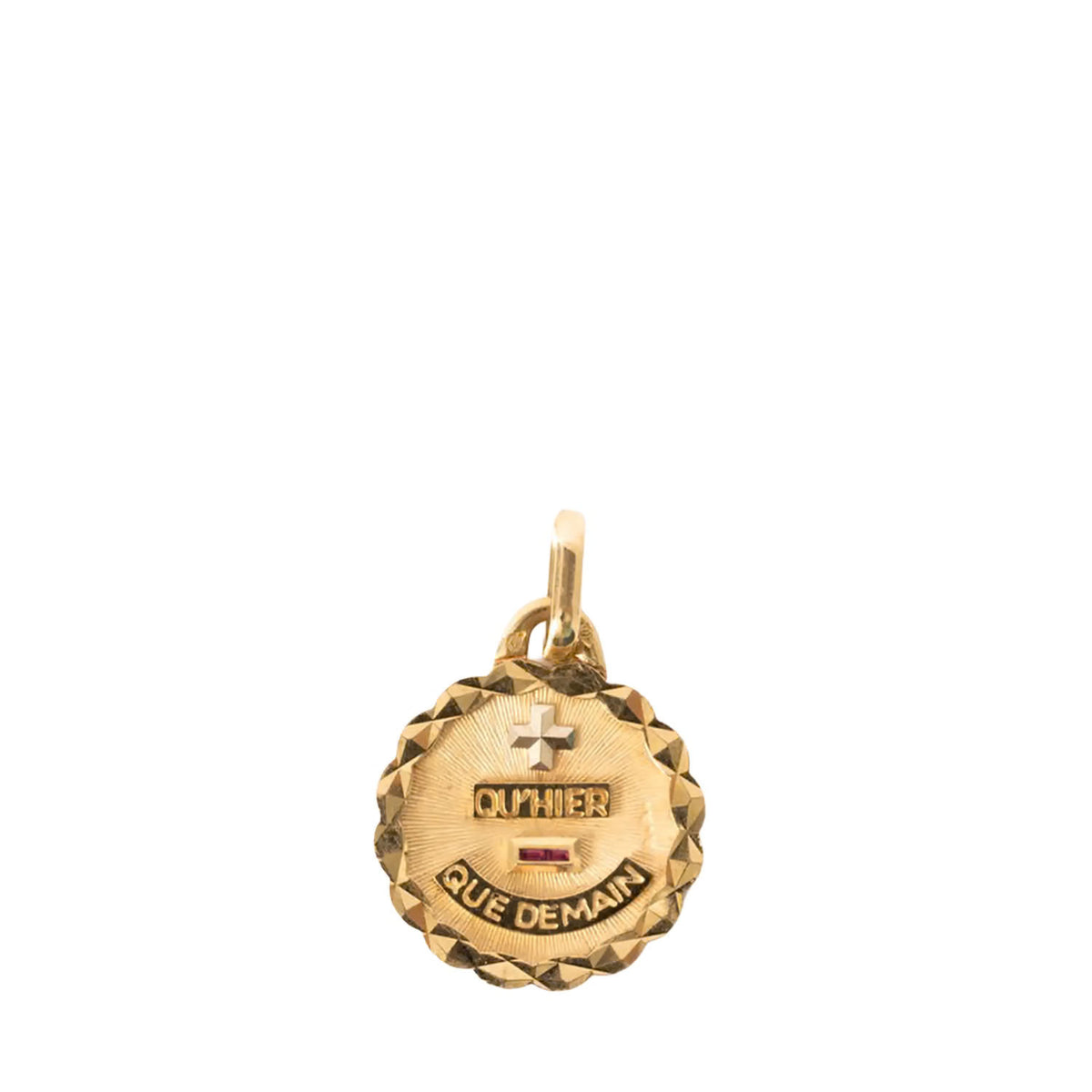 A gold-toned round pendant charm with a faceted edge, featuring a cross, the name 'OCTAVIER', and the words 'QUE DEMAIN' on a plain white background.