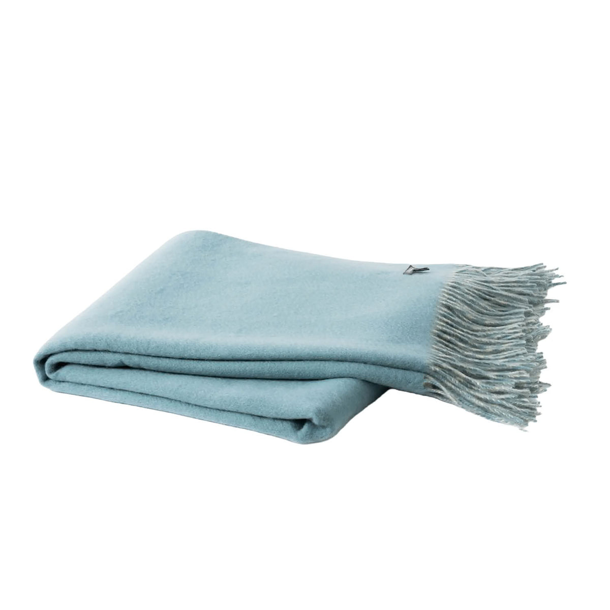 A folded light blue throw blanket with fringed edges, displayed on a clean white background.
