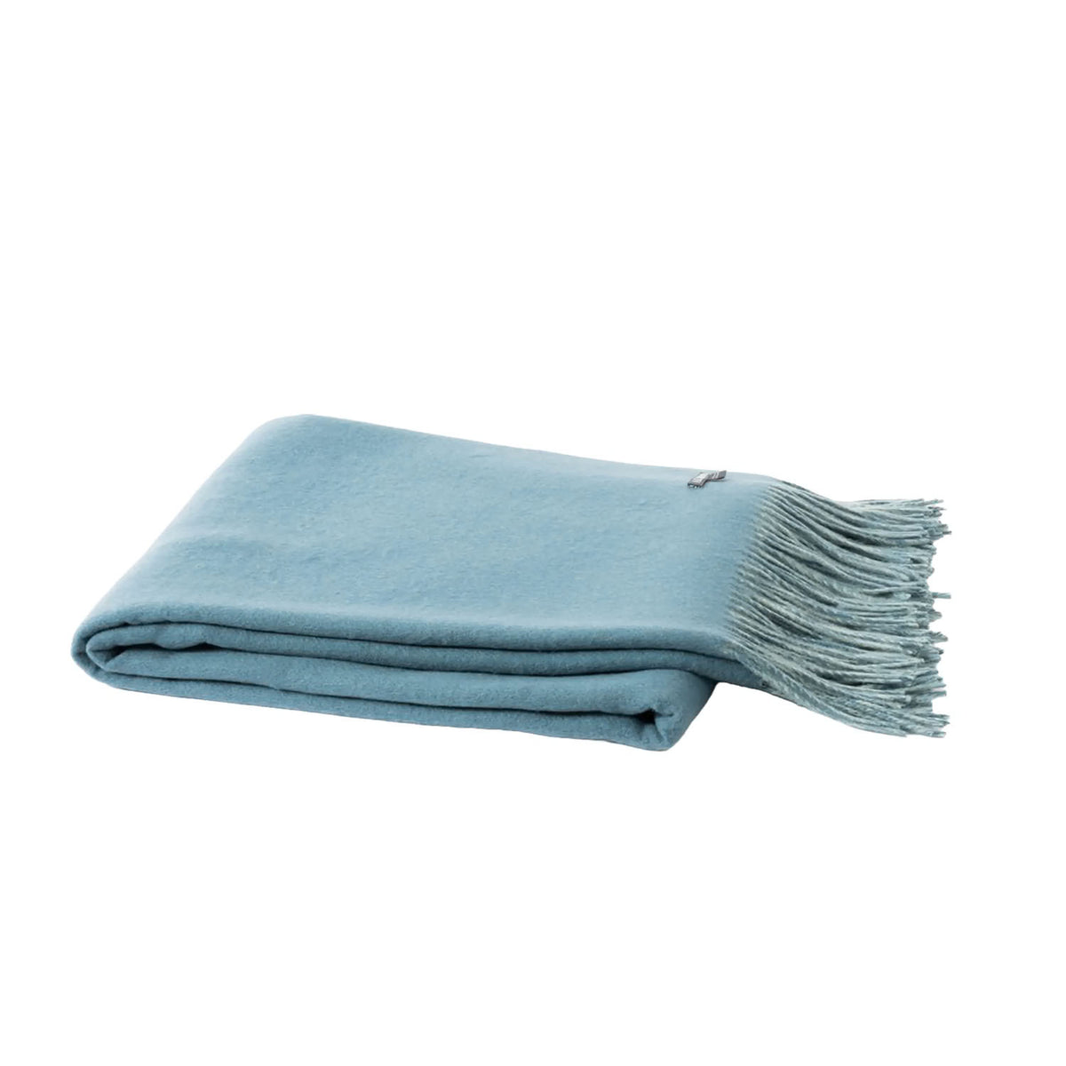 A folded light blue throw blanket with fringed edges, displayed on a clean white background.