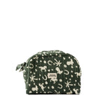 A quilted cosmetic pouch in dark green with a cream-colored animal and nature print, featuring a small white brand label that reads 'MAISON AUGUSTIN'.