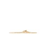 A delicate gold tennis bracelet with small clear stones, shown horizontally against a plain white background.