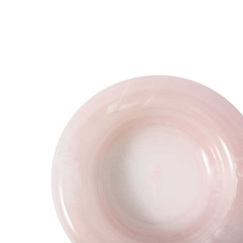 Close-up of a pink ceramic bowl on a white background