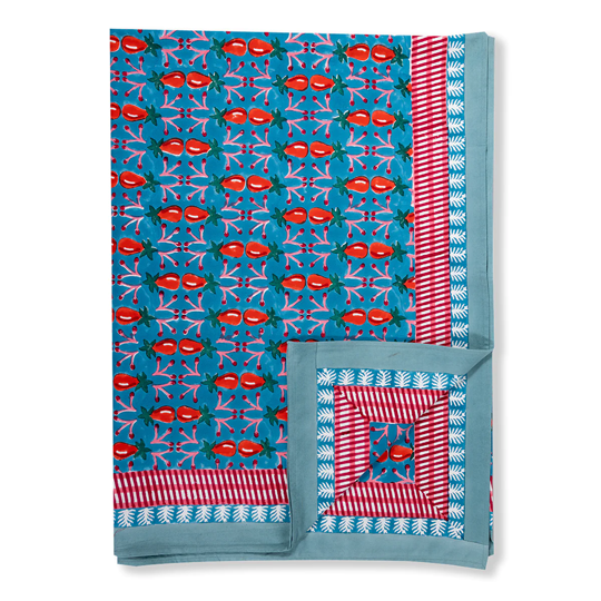 blue green tablecloth with red and pink details