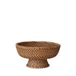 Woven rattan footed bowl on a white background