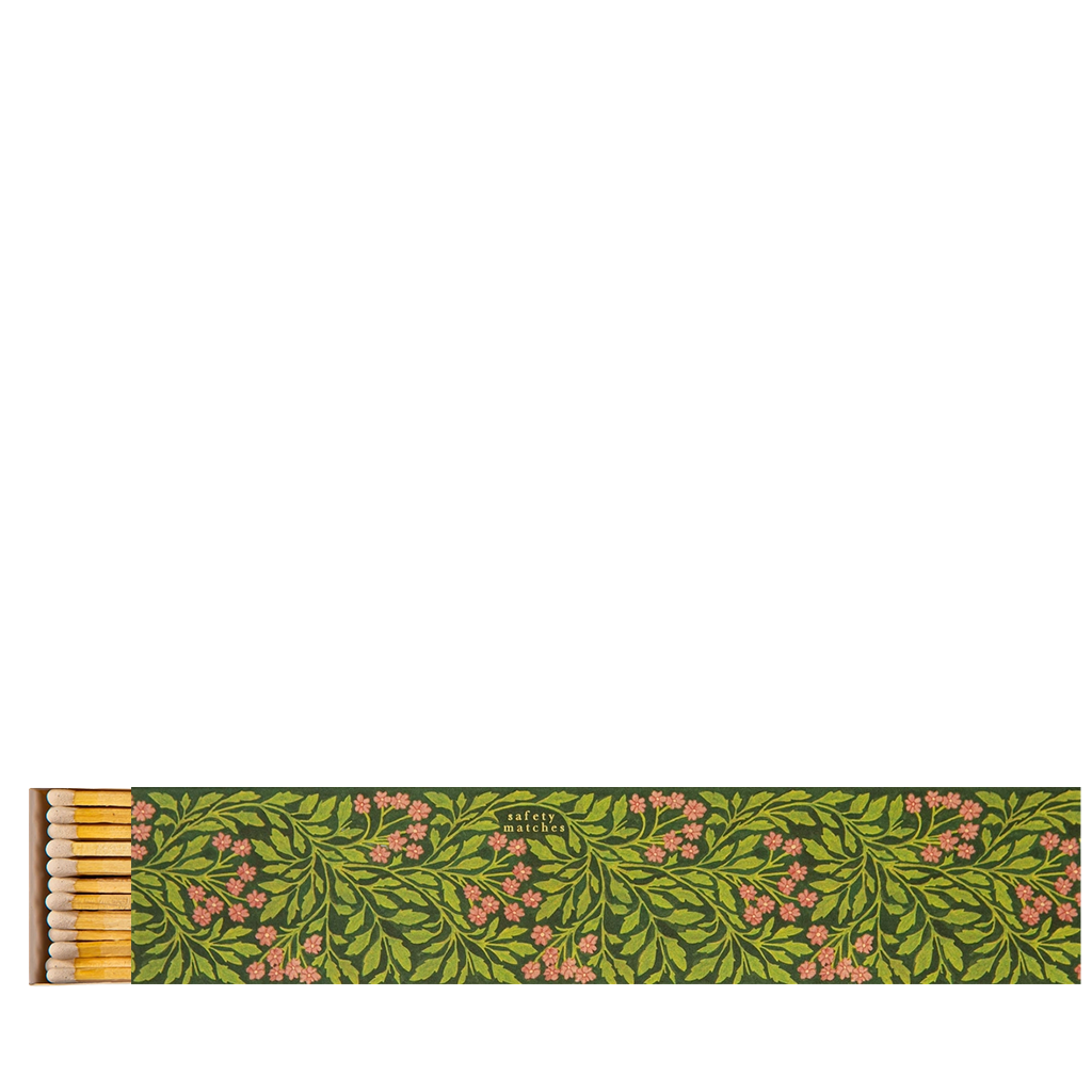 Matchbox with floral design on a white background