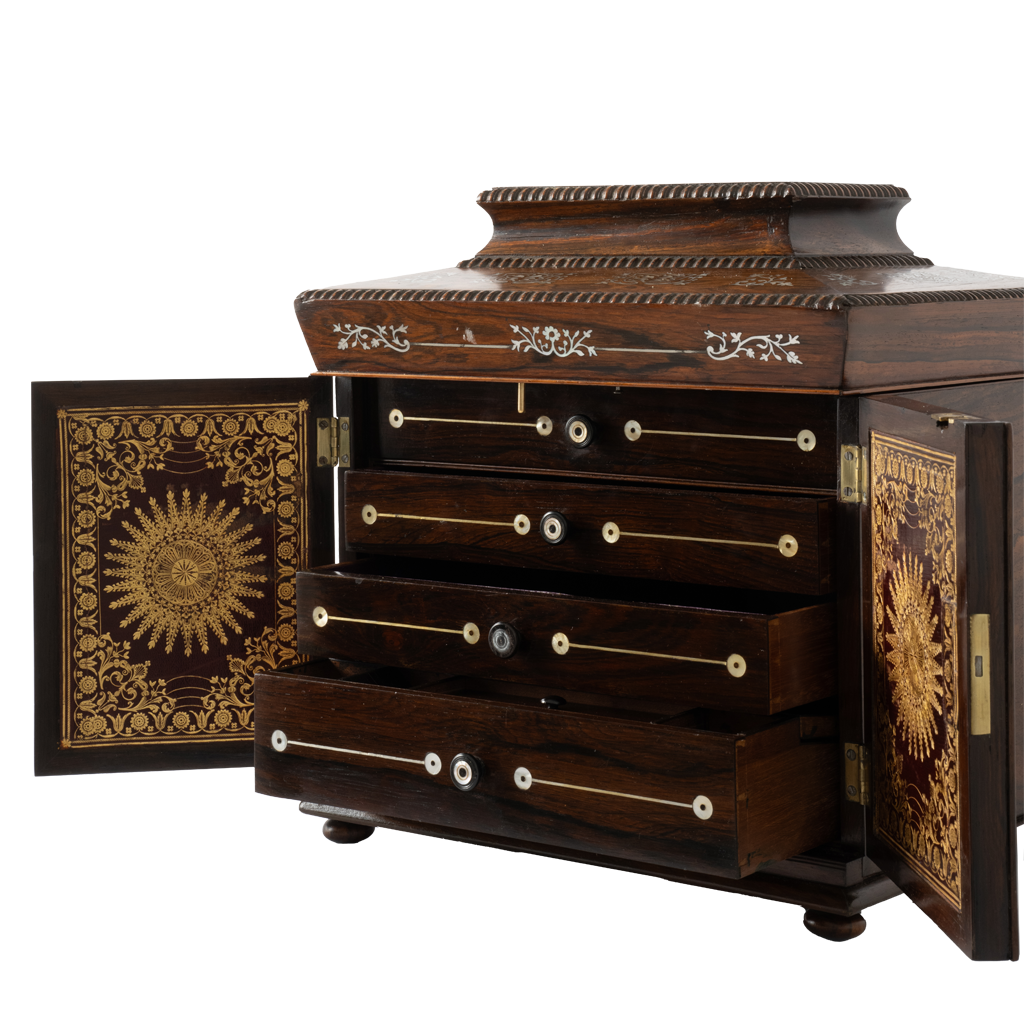 Antique jewelry box with ornate mother of pearl inlay and two open doors with gold details.