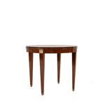 Round side table with brass detailing and a mahogany wood top, known as the Audrey Side Table.