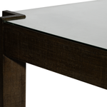 Close-up of a dark wood table with a white surface