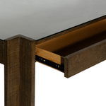 Wooden drawer with glass top on a plain background