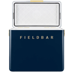 The navy blue FIELDBAR cooler is shown with its lid open, revealing a white insulated interior with a quilted pattern and a black sealing gasket around the edge. Gold lettering on the front and gold hardware accents complement the cooler's clean, premium design against a white background.