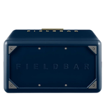 The underside of the navy blue FIELDBAR cooler is shown, featuring an embossed FIELDBAR logo centered on the base. Reinforced metal corner plates and exposed screws add durability while maintaining the cooler's premium design.