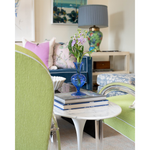 blue vase on top of books