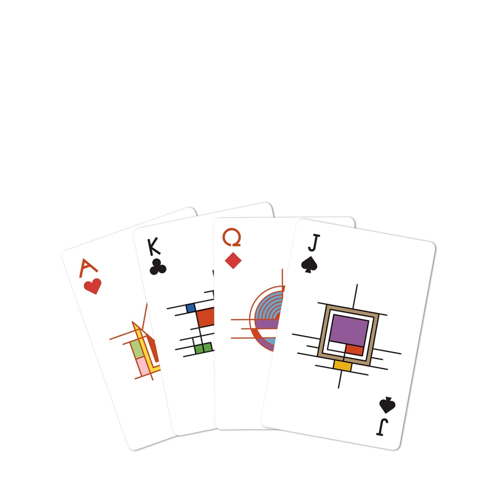 Four playing cards with abstract designs on a white background