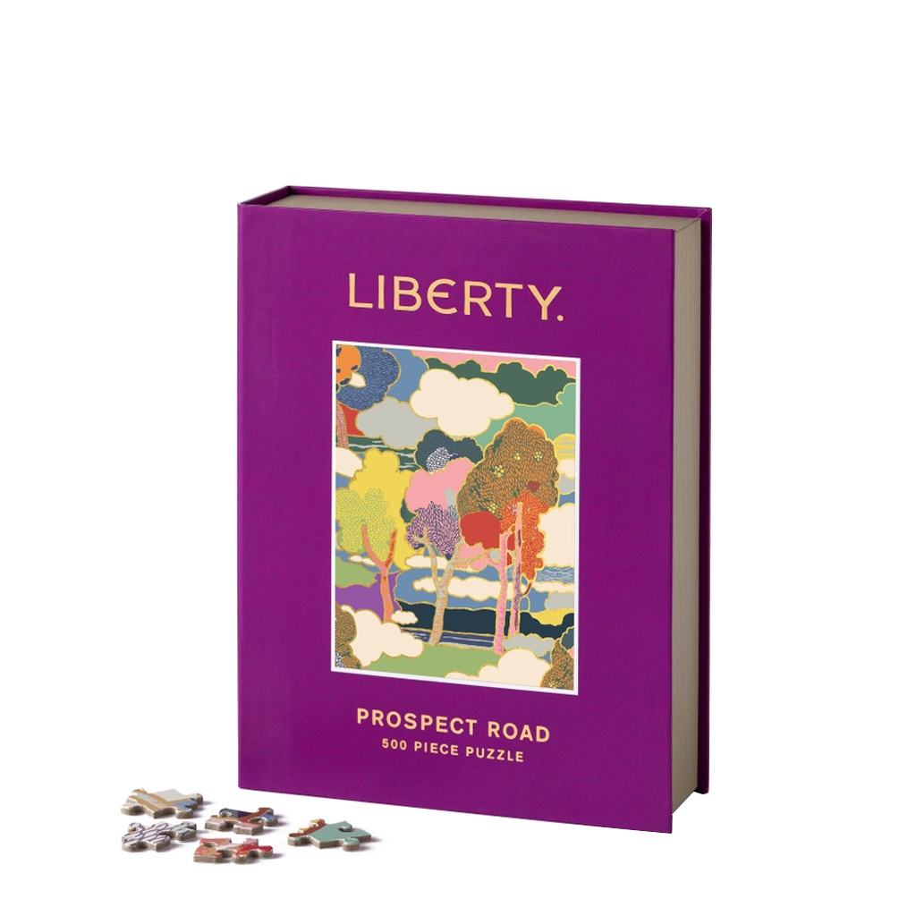 Purple puzzle box with 'Liberty' branding and a colorful illustration on a white background