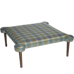 Plaid ottoman with wooden legs on a white background