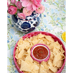 pink chip and dip server with salsa on a blue patterned tabelcloth