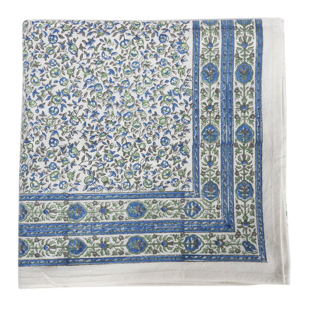 Floral patterned fabric with blue and green accents on a white background