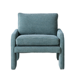 Blue armchair with a textured pattern on a white background