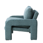 Blue textured armchair on a white background