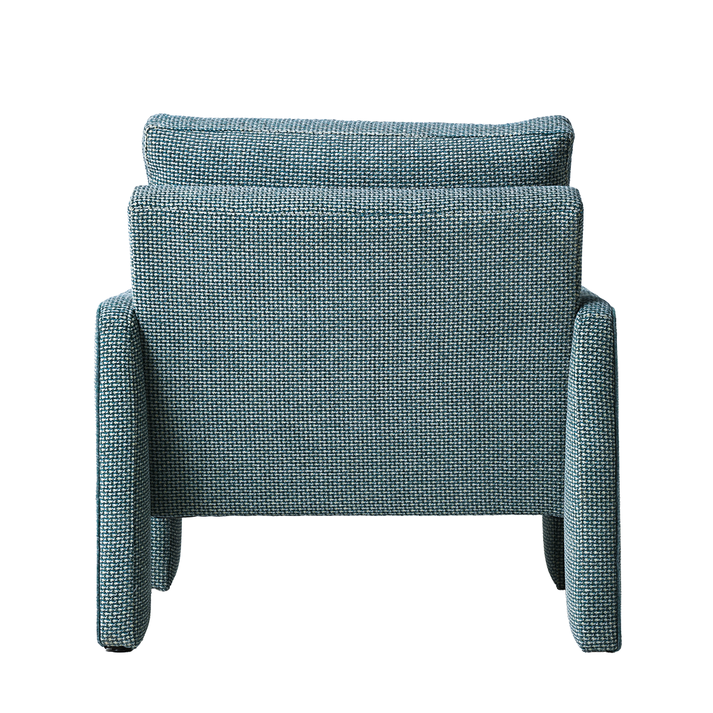 Blue armchair with textured fabric on a white background