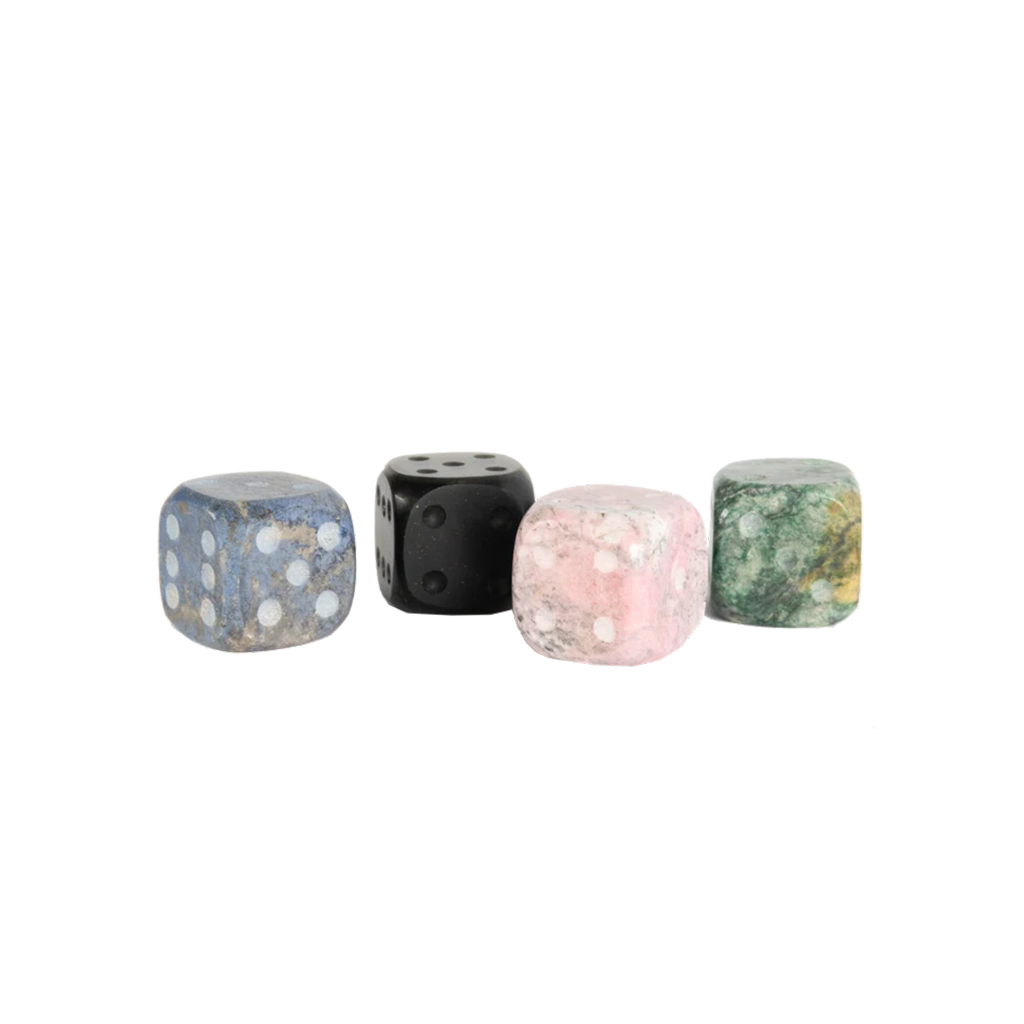 Four dice with different patterns on a white background